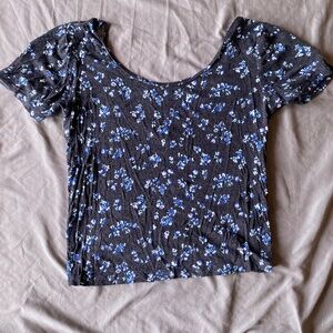 Black crop top with blue floral pattern